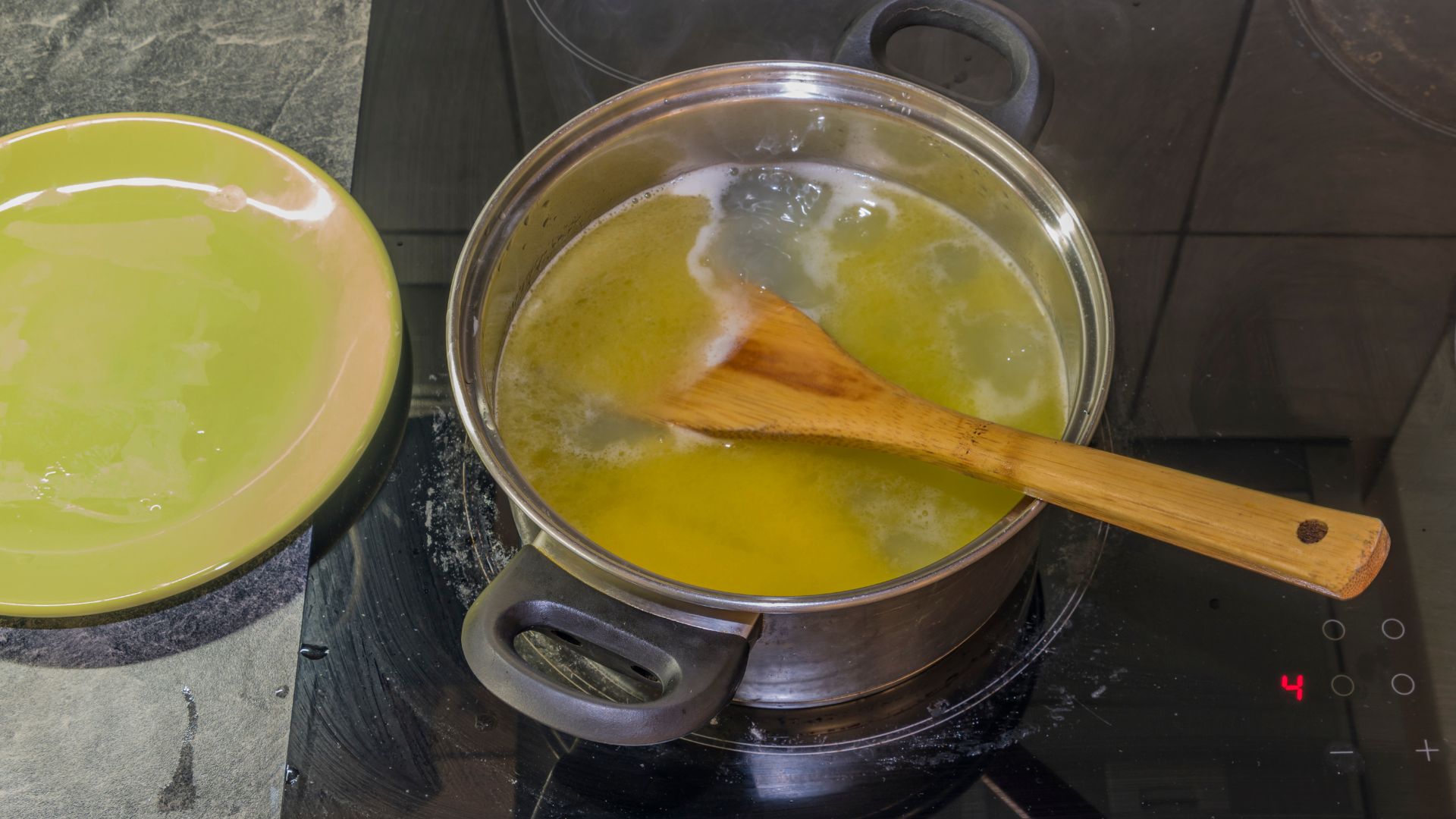 Butter melting in a pot before mixing with THC kief