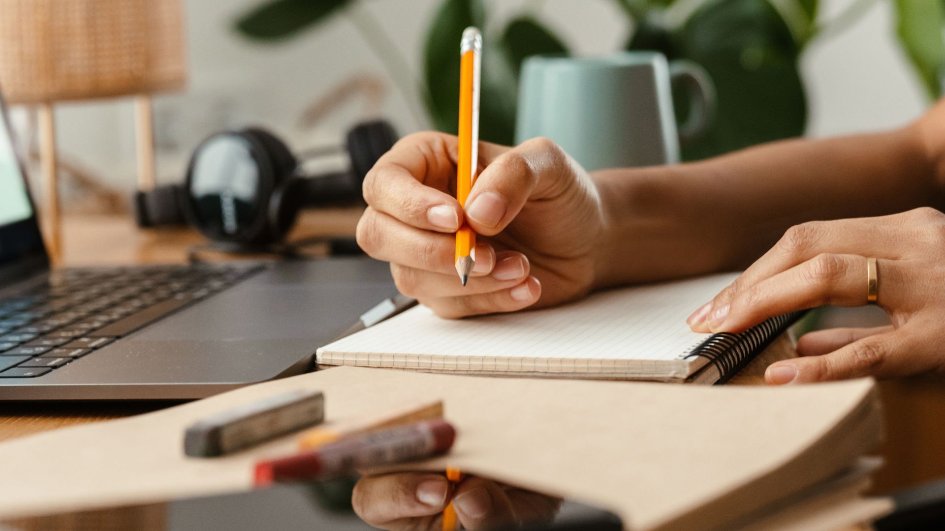 Person writing in a notebook while researching kief meaning